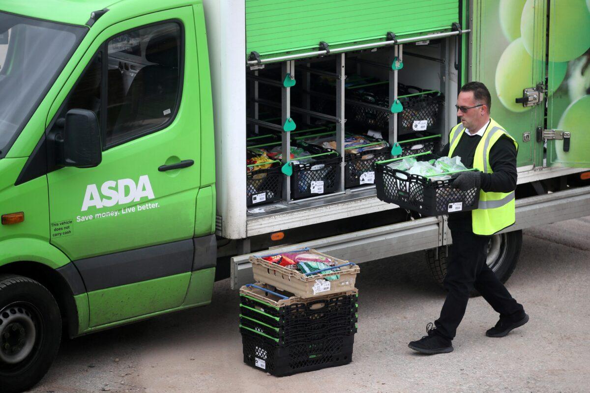 An Asda employee makes a delivery in Keele, Britain, on April 1, 2020. (Carl Recine/Reuters)