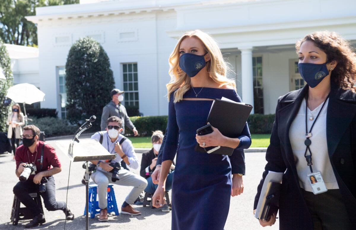 White House press secretary Kayleigh McEnany walks to speak to reporters outside the White House in Washington on Oct. 2, 2020. (Saul Loeb/AFP via Getty Images)