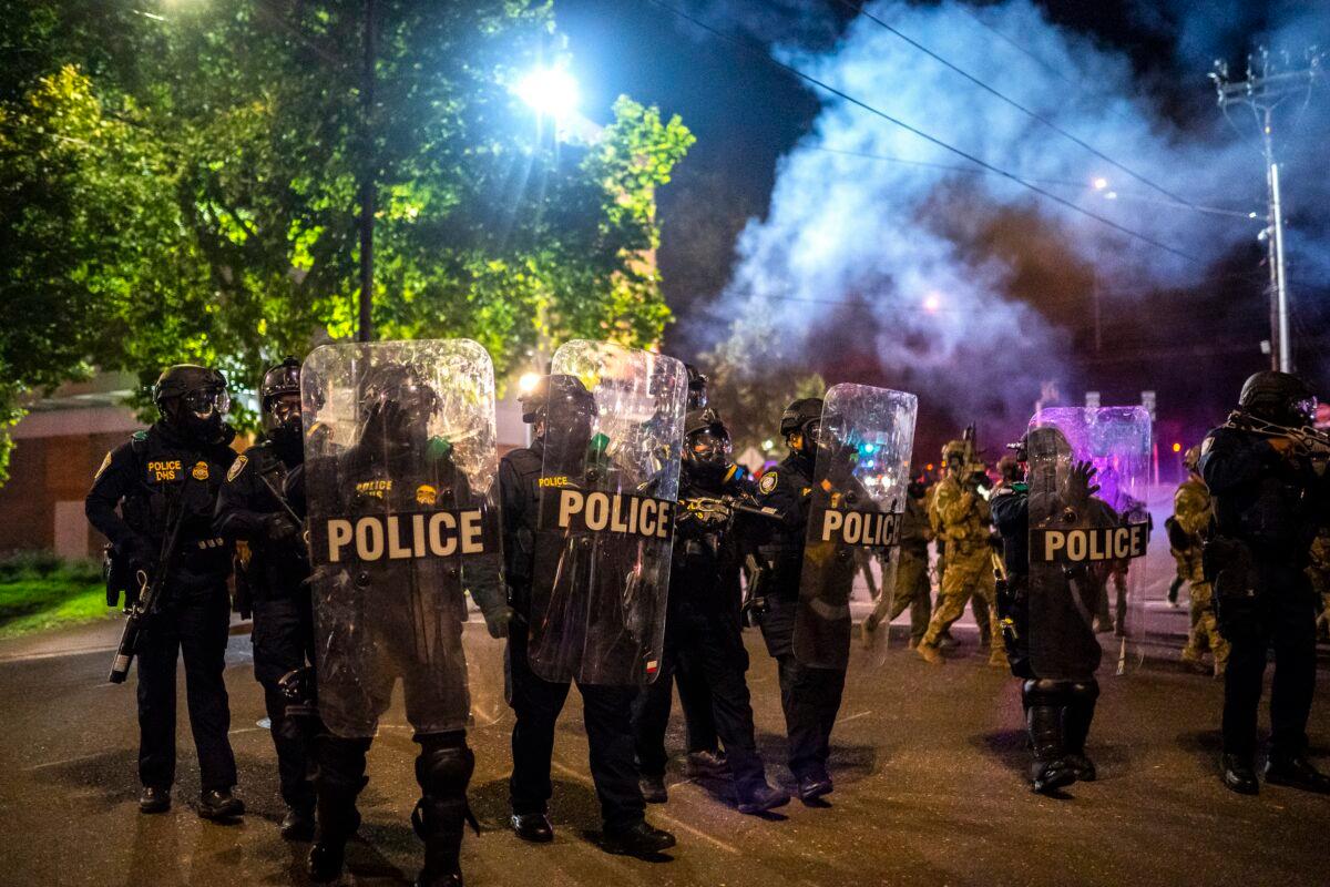Federal officers disperse rioters in Portland, Ore., on Oct. 6, 2020. (Nathan Howard/Getty Images)