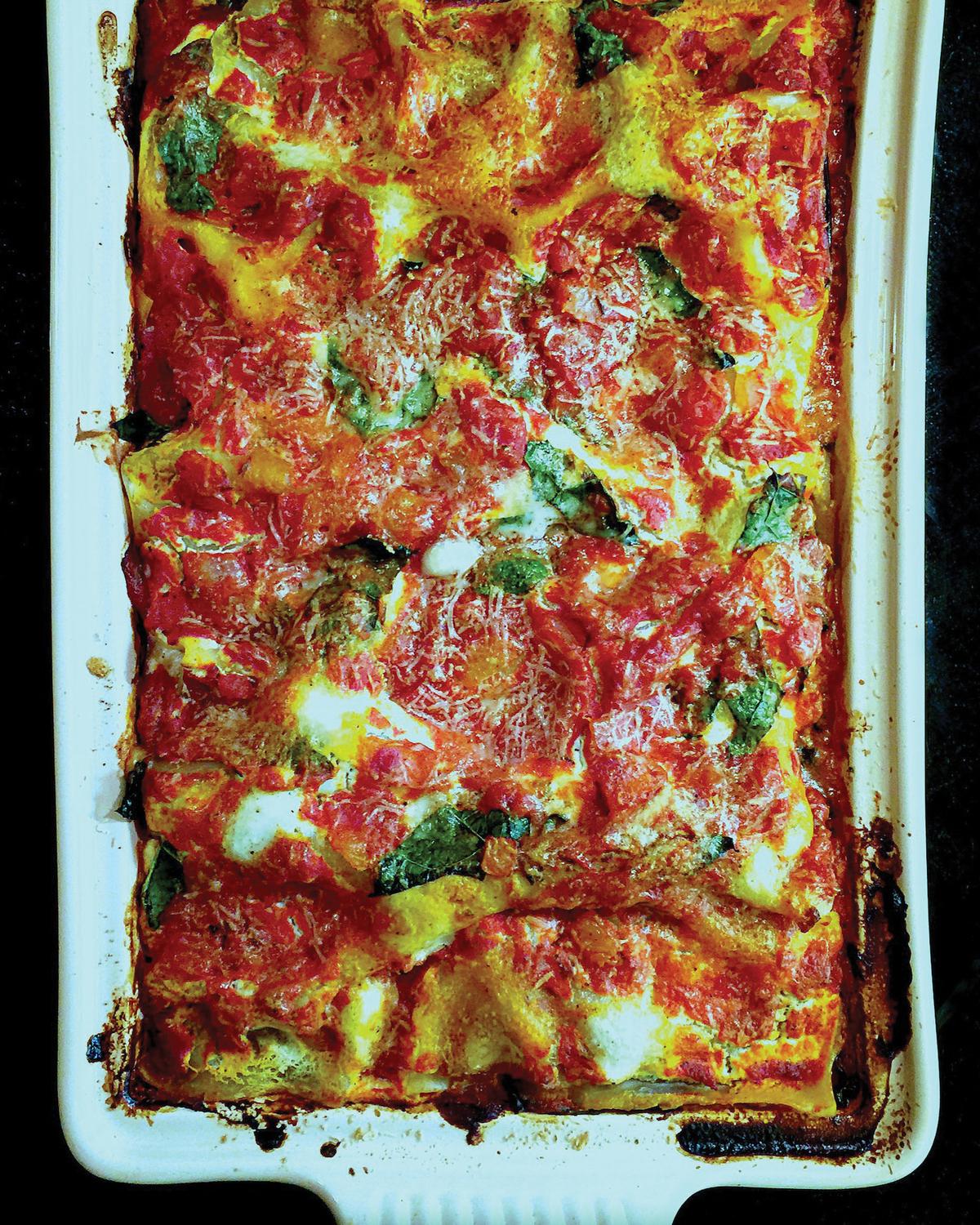 This hefty casserole is layered with three cheeses, a meaty tomato sauce and—wait for it—kale. (Lynda Balslev for TasteFood)