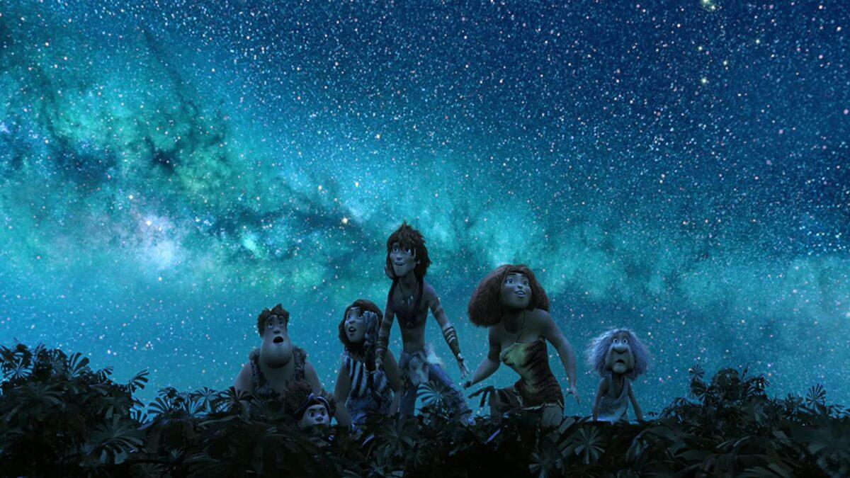 Guy (C, voiced by Ryan Reynolds) shows the Crood family the Milky Way by climbing to the top of the rainforest in DreamWorks’ caveman chronicle, “The Croods.” (DreamWorks Animation/Twentieth Century Fox)