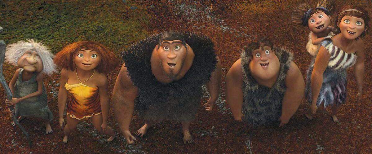 (L–R Gran (voiced by Cloris Leachman), Eep (voiced by Emma Stone), Grug (voiced by Nicolas Cage), Thunk (voiced by Clark Duke), Sandy (voiced by Randy Thom), and Ugga (voiced by Catherine Keener), in DreamWorks’ caveman chronicle, “The Croods.” (DreamWorks Animation/Twentieth Century Fox)