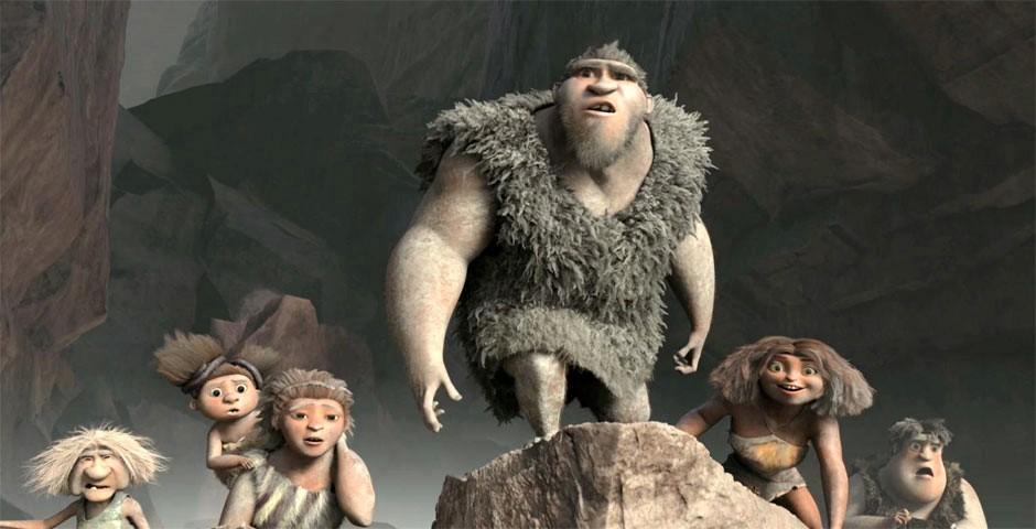 Grug (C, voiced by Nicolas Cage) leads his family out of an earthquake into the future, in DreamWorks' caveman chronicle, “The Croods.” (DreamWorks Animation/Twentieth Century Fox)