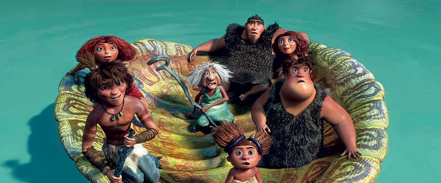 The Croods floating in a giant turtle shell in a tropical ocean in DreamWorks' caveman chronicle, “The Croods.” (DreamWorks Animation/Twentieth Century Fox)