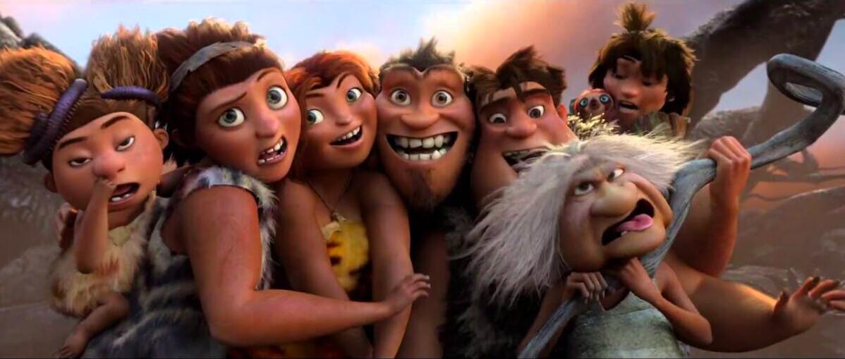 (L–R) Sandy (voiced by Randy Thom), Ugga (voiced by Catherine Keener), Eep (voiced by Emma Stone), Grug (voiced by Nicolas Cage), Thunk (voiced by Clark Duke), Gran (voiced by Cloris Leachman), and Guy (voiced by Ryan Reynolds) in DreamWorks' caveman chronicle, “The Croods.” (DreamWorks Animation/Twentieth Century Fox)