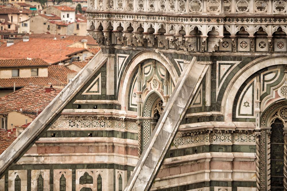 The exterior of the cathedral is decorated in a geometric arrangement of white marble from Carrara, green marble from Prato, and red marble from Siena. (Steve Lovegrove/Shutterstock)