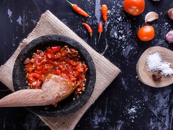 Traditional Indonesian home cooks grind sambal using a heavy cobek and ulekan, a version of the mortar and pestle. Happily, using a food processor takes no time at all, and it still tastes delicious. (Erna Amanda/Shutterstock)