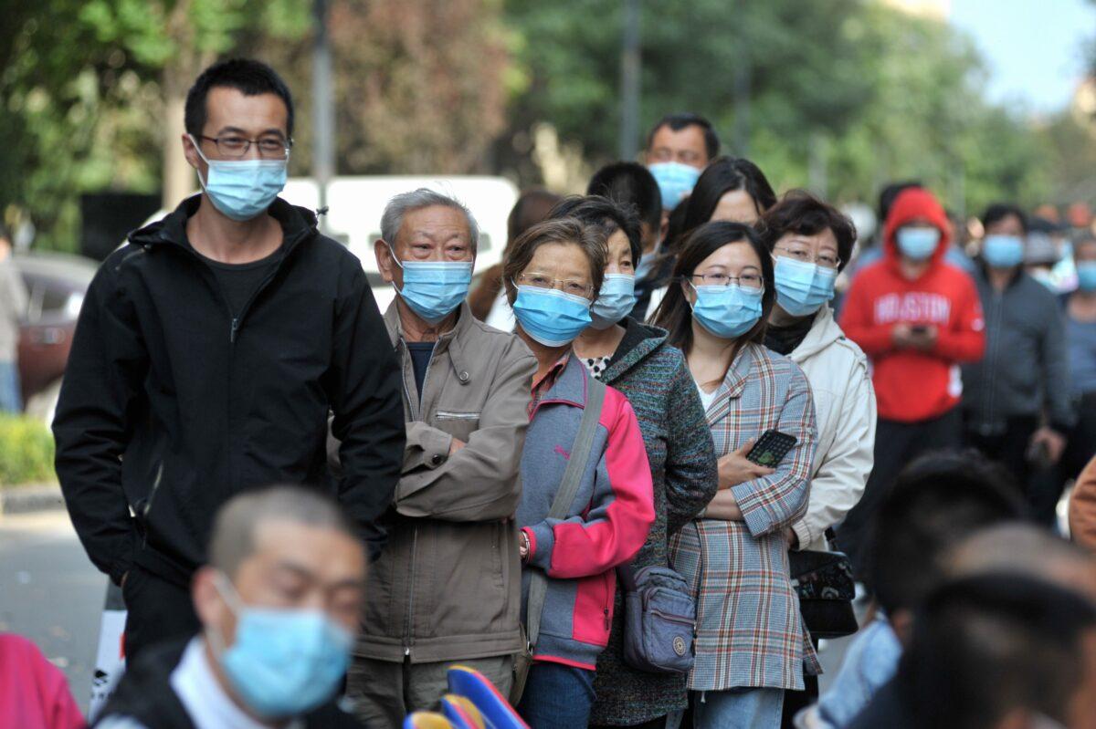 Residents line up to be tested for the COVID-19 coronavirus, as part of a mass testing program following a new coronavirus outbreak in Qingdao, in China's eastern Shandong Province on Oct. 12, 2020. (STR/AFP via Getty Images)