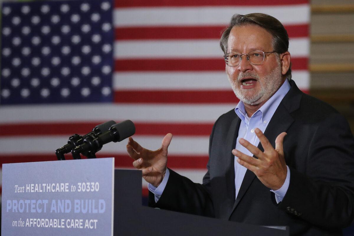 Sen. Gary Peters (D-Mich.) speaks at a campaign event with Democratic presidential nominee Joe Biden in Southfield, Mich., on Oct. 16, 2020. (Chip Somodevilla/Getty Images)
