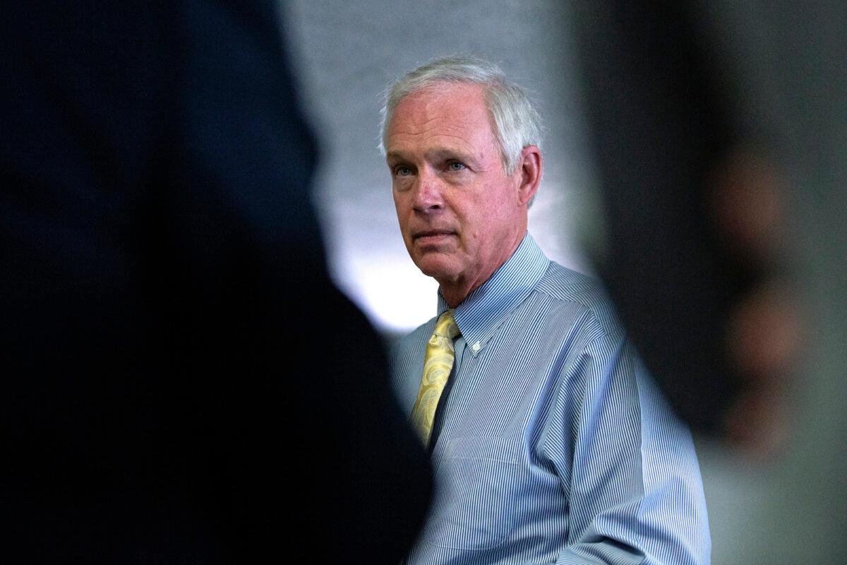 Sen. Ron Johnson (R-Wis.) speaks to members of the media as he arrives for the weekly Senate Republican policy luncheon in the Hart Senate Office Building on June 30, 2020, in Washington. (Stefani Reynolds/Getty Images)