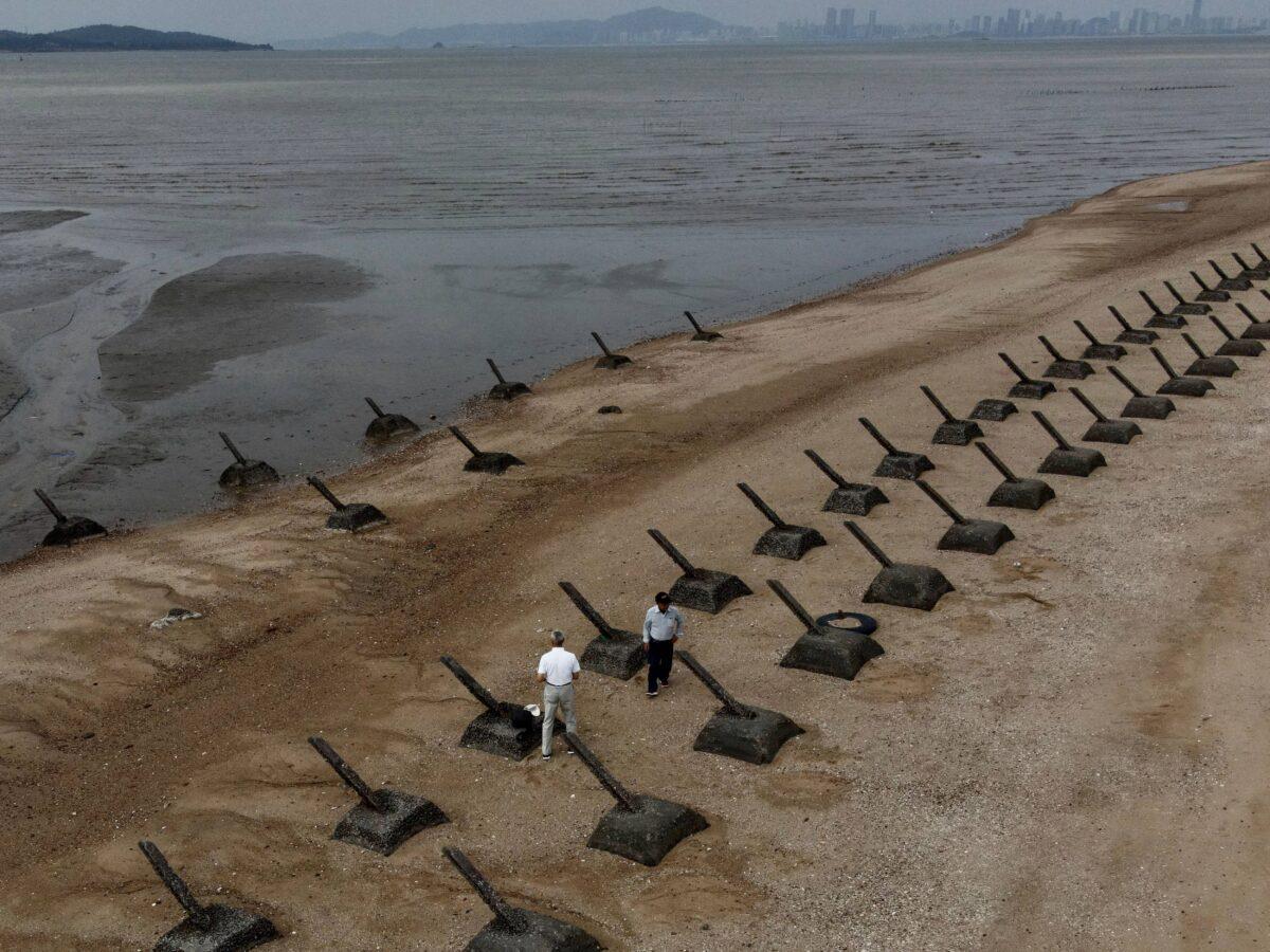 Tourists are visiting the anti-landing spikes on the coast of Kinmen, the front line islands of Taiwan, on Oct. 20, 2020. (Sam Yeh/AFP via Getty Images)