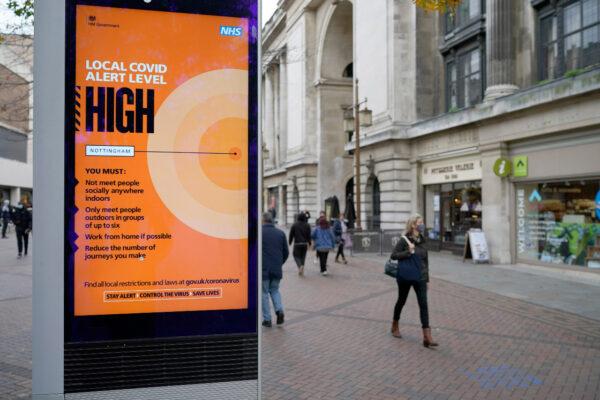 People walk through Nottingham City centre ahead of Tier 3 restrictions set to take effect in Nottingham on Oct. 28, 2020. (Christopher Furlong/Getty Images)