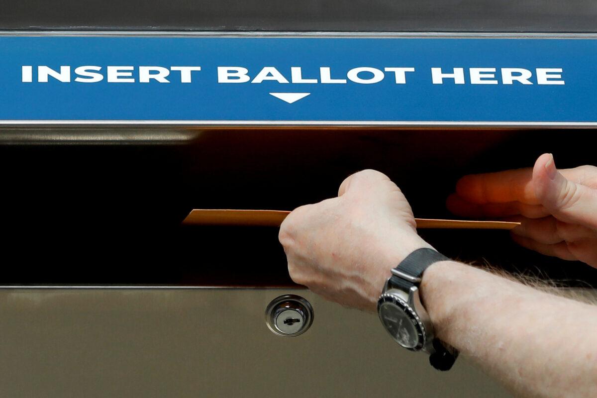 A sample ballot is inserted into a ballot drop box in New York City, on Aug. 31, 2020. (Mike Segar/Reuters)
