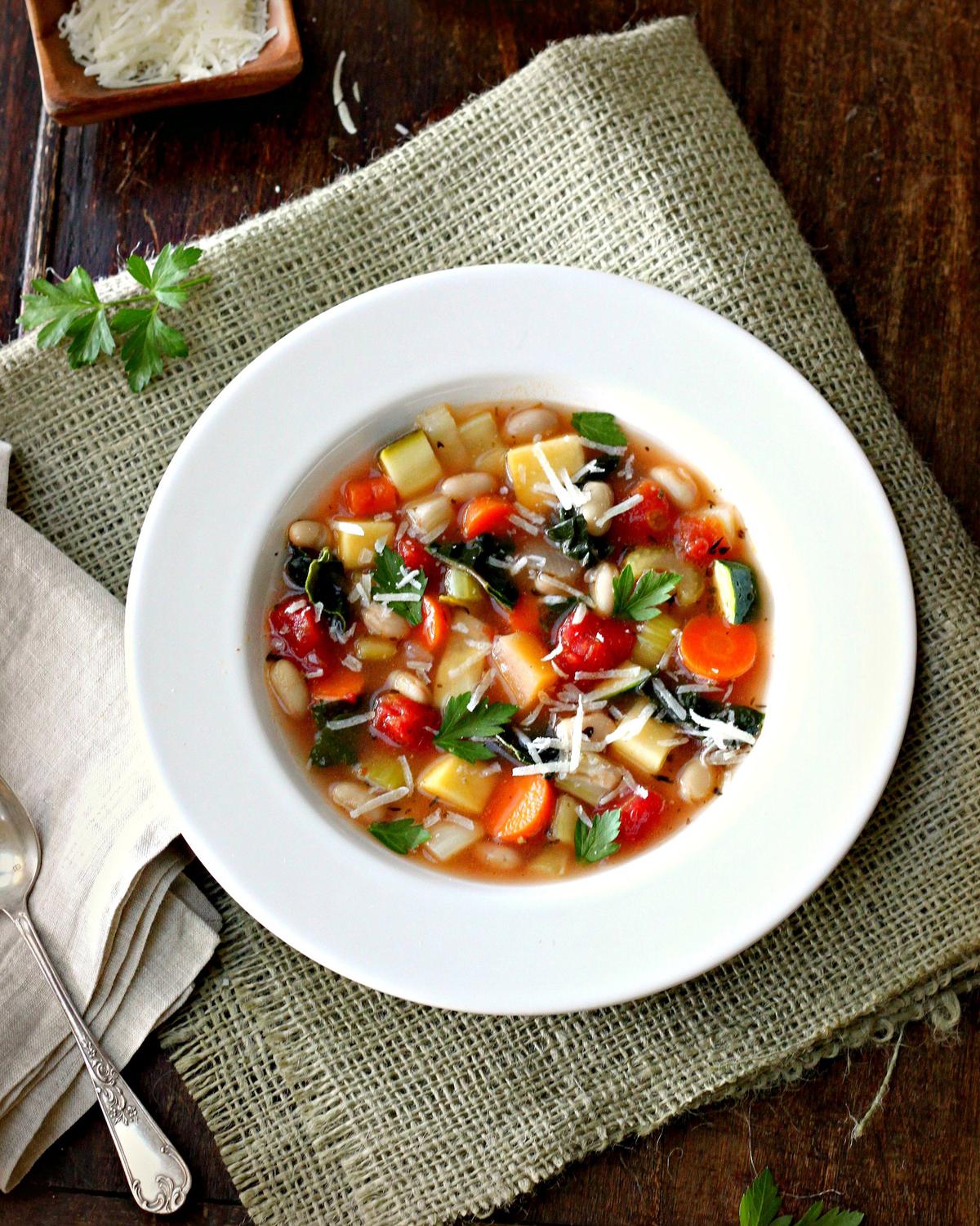 Brimming with diced vegetables swirling in a tomato-infused stock, minestrone is rustic, filling, and layered with flavor. (Lynda Balslev for TasteFood)