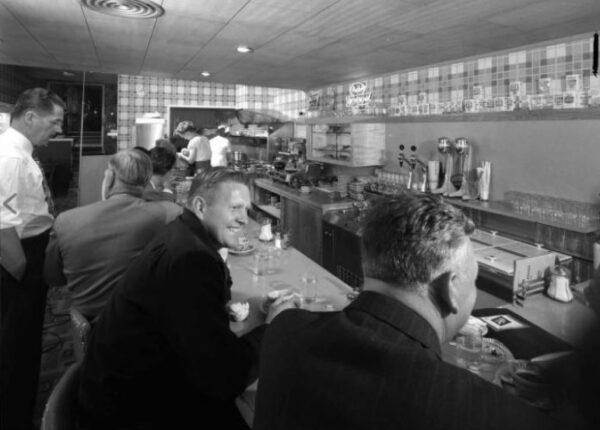 Customers sit in the Coast Inn coffee shop in the 1950s. (Courtesy of Carolyn Smith Burris)