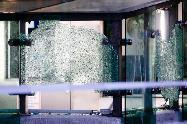 After a shooting the glass at the entrance of a car park is seen broken in Vienna on Nov. 3, 2020. (Ronald Zak/AP Photo)
