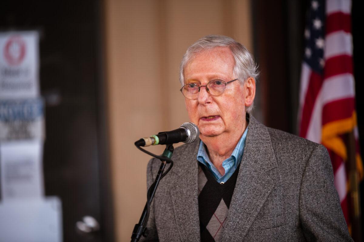 Senate Majority Leader Mitch McConnell (R-Ky.) speaks to the press and his supporters during a campaign stop in Lawrenceburg, Ky., on Oct. 28, 2020. (Jon Cherry/Getty Images)
