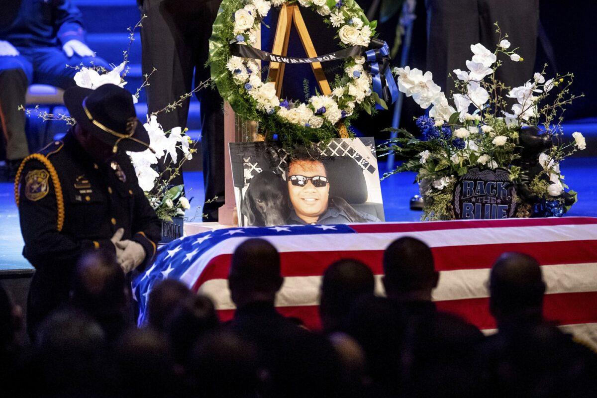 A picture of slain Newman police Cpl. Ronil "Ron" Singh rests atop the casket during his funeral in Modesto, Calif., on Jan. 5, 2019. (Noah Berger/AP Photo)