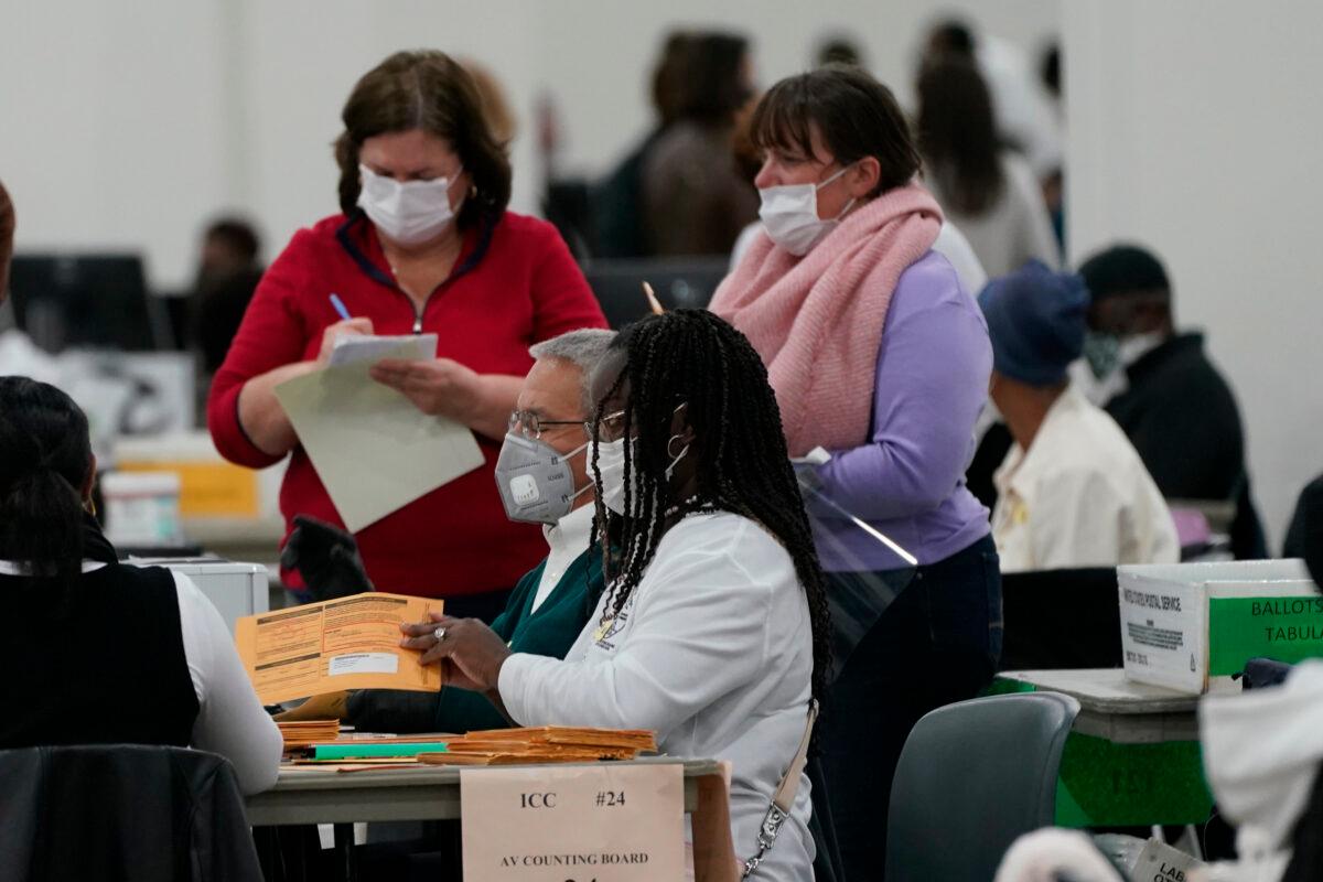 Absentee ballots are processed at the central counting board in Detroit, Mich., on Nov. 4, 2020. (Carlos Osorio/AP Photo)