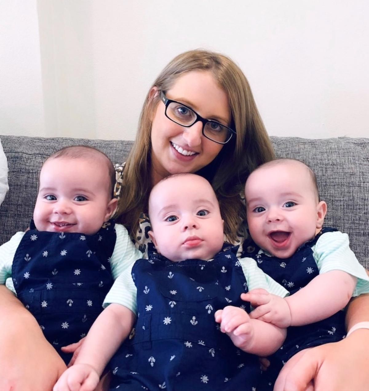 Allana Allard, 29, with her identical triplets, Jaxon, Zac, and Zavier. (Caters News)