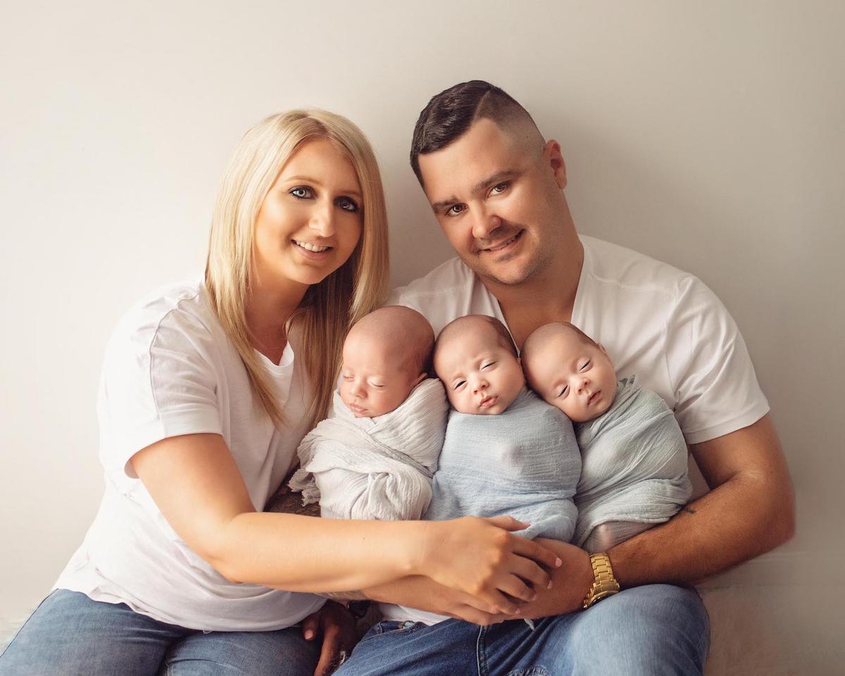 Allana Allard, 29, Tim, 31, and their identical triplets, Jaxon, Zac, and Zavier. (Jo Searle Newborn & Baby Photography/Caters News)