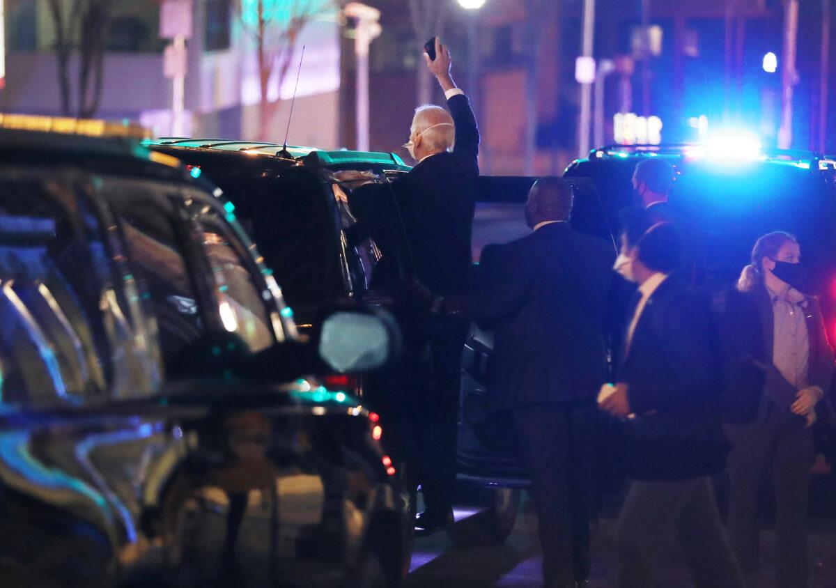 Democratic presidential nominee Joe Biden waves to supporters as he leaves the Queen Theater after he held a meeting with House Speaker Nancy Pelosi (D-Calif.) and Senate Minority Leader Chuck Schumer (D-N.Y.), in Wilmington, Del., on Nov. 20, 2020. (Joe Raedle/Getty Images)