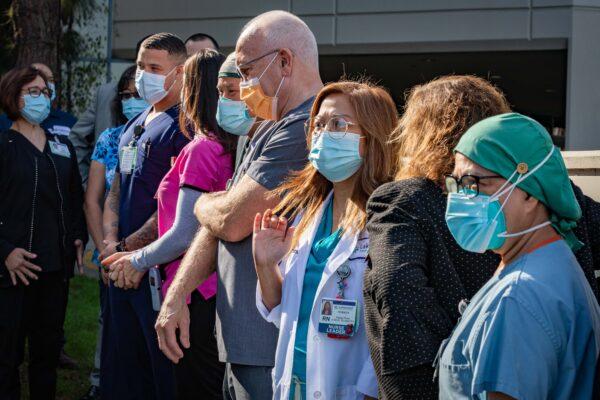 Healthcare staff at Lakewood Regional Medical Center gather to receive medals made for them by Long Beach College students in Lakewood, Calif., on Nov. 20, 2020. (John Fredricks/The Epoch Times)