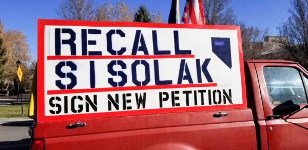 A sign on a truck calls for signatures to recall Nevada Governor Steve Sisolak, in Carson City, Nev., on Nov. 21, 2020. (Andy Ellsmore/The Epoch Times)