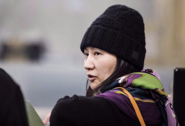 Huawei chief financial officer Meng Wanzhou arrives at a parole office building in Vancouver on Dec. 12, 2018. (Darryl Dyck/The Canadian Press)