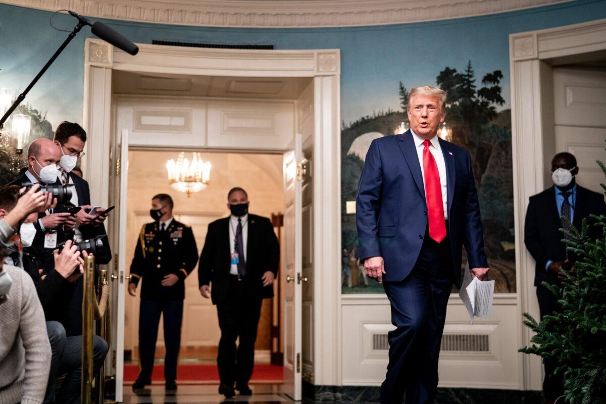 President Donald Trump arrives to speak in the Diplomatic Room of the White House on Nov. 26, 2020. (Erin Schaff/Pool/Getty Images)