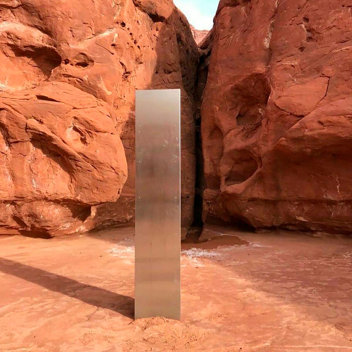 A metal monolith in the ground in a remote area of red rock in Utah. (Utah Department of Public Safety via AP)