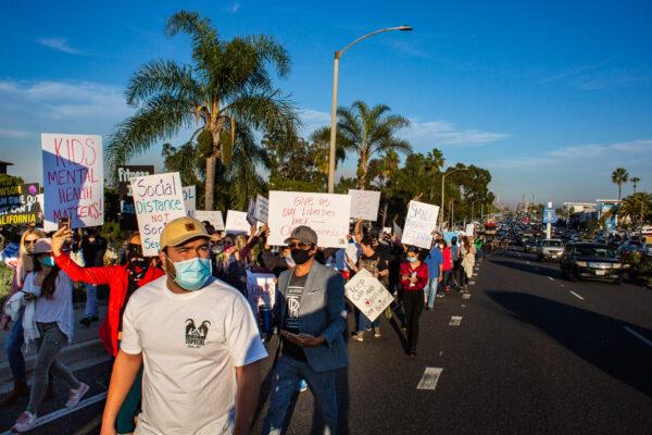 Demonstrators gathered peacefully to march down several blocks of Second Street in Long Beach, Calif., on Dec. 2, 2020. (John Fredricks/The Epoch Times)