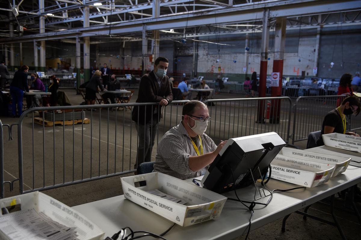 A poll watcher monitors the counting of ballots at the Allegheny County elections warehouse in Pittsburgh on Nov. 6, 2020. (Jeff Swensen/Getty Images)
