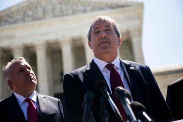 Texas Attorney General Ken Paxton speaks to reporters at a news conference outside the Supreme Court on Capitol Hill in Washington on June 9, 2016. (Gabriella Demczuk/Getty Images)