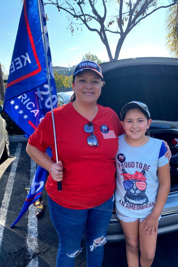 Alicia Rodriguez (L), whose father escaped communism in Cuba, attends a pro-freedom "Stop the Steal" rally with her daughter in Santa Ana, Calif., on Dec. 6, 2020. (Jack Bradley/The Epoch Times)