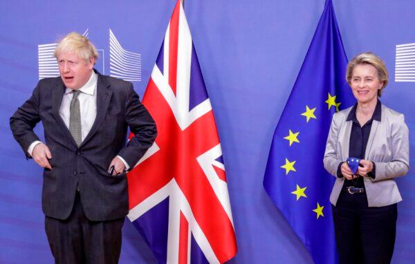 UK Prime Minister Boris Johnson is welcomed by European Commission President Ursula von der Leyen prior to a working dinner at the EU headquarters in Brussels, on Dec. 9, 2020. (Olivier Hoslet/Pool/AFP via Getty Images)
