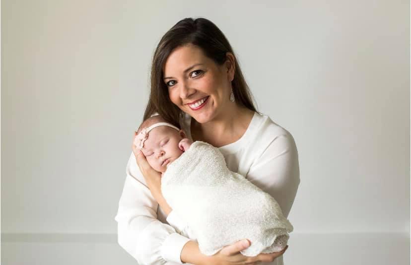 Dana with her baby daughter, Emily. (Courtesy ofRyan Wilson PhotographyviaDana and Brent Bythewood)