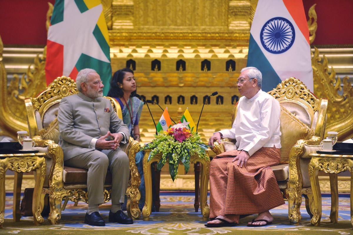 Indian Prime Minister Narendra Modi (L) speaks with the President of Burma (also known as Myanmar) Htin Kyaw during the first day of a two-day official visit to Burma on Sept. 5, 2017. The two-day visit comes as renewed violence in Burma's Rakhine state forces thousands of Rohingya Muslims to seek refuge in neighboring Bangladesh, with many drowning as they attempt to cross the border river in makeshift boats. (Aung Htet/AFP via Getty Images)