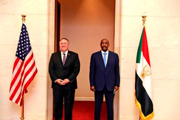 U.S. Secretary of State Mike Pompeo stands with Sudanese Gen. Abdel-Fattah Burhan in Khartoum, Sudan, on Aug. 25, 2020. (Sudanese Cabinet via AP)