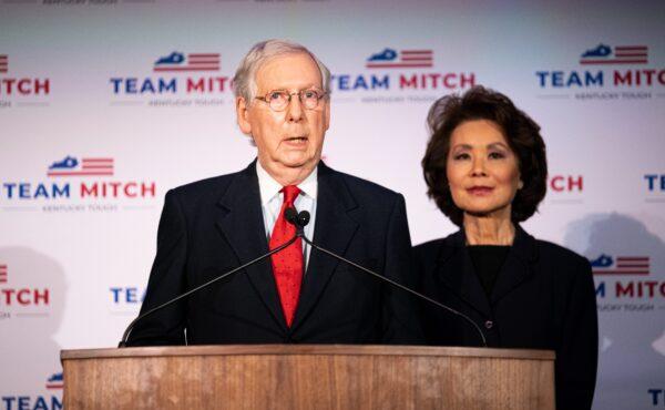Senate Majority Leader Mitch McConnell (R-Ky.), delivers his victory speech next to his wife, Elaine Chao, at the Omni Louisville Hotel in Louisville, Ky. on Nov. 3, 2020. (Jon Cherry/Getty Images)