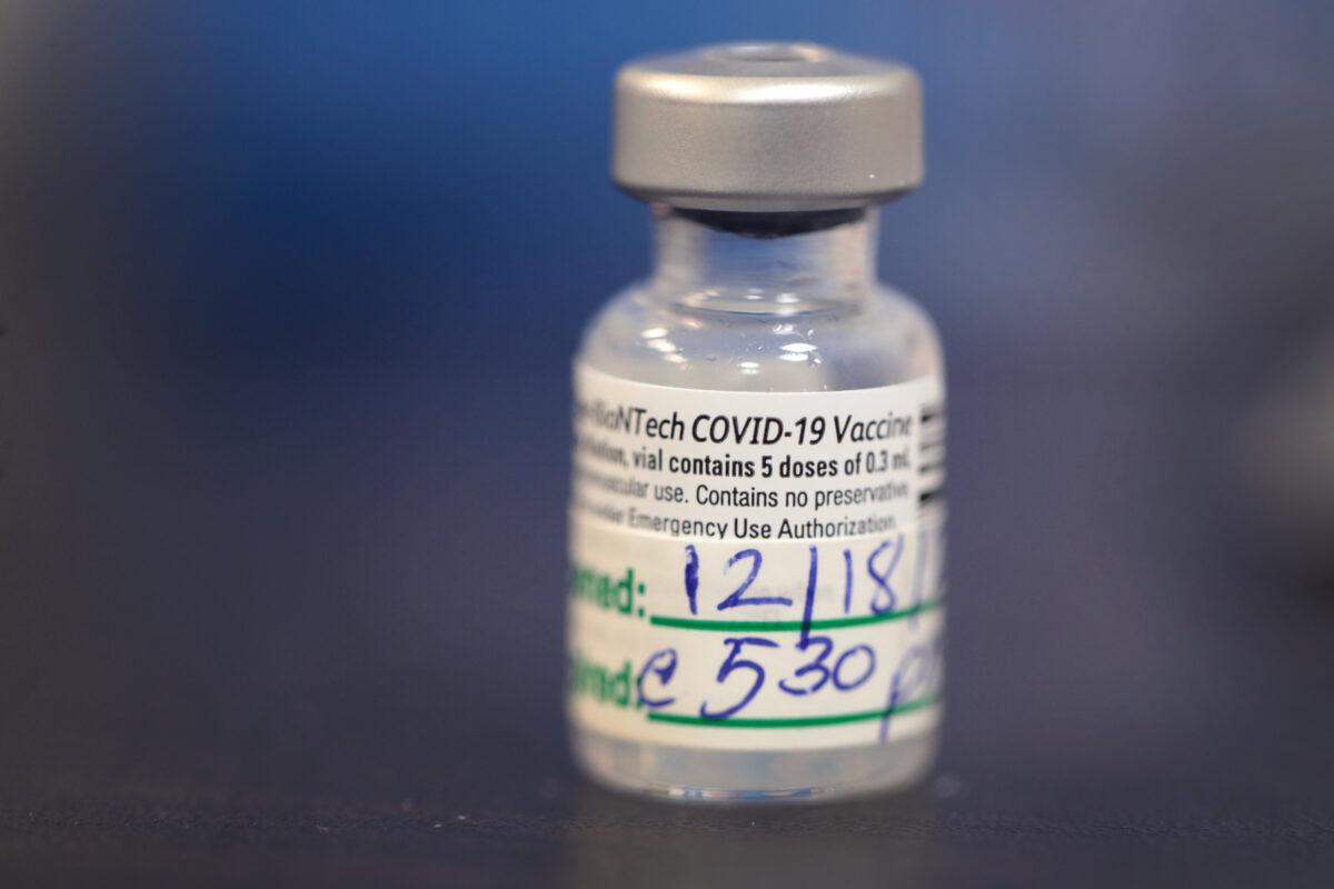 A container of 5 doses of COVID-19 vaccine sits on a table at Roseland Community Hospital in Chicago on Dec. 18, 2020. (Scott Olson/Getty Images)