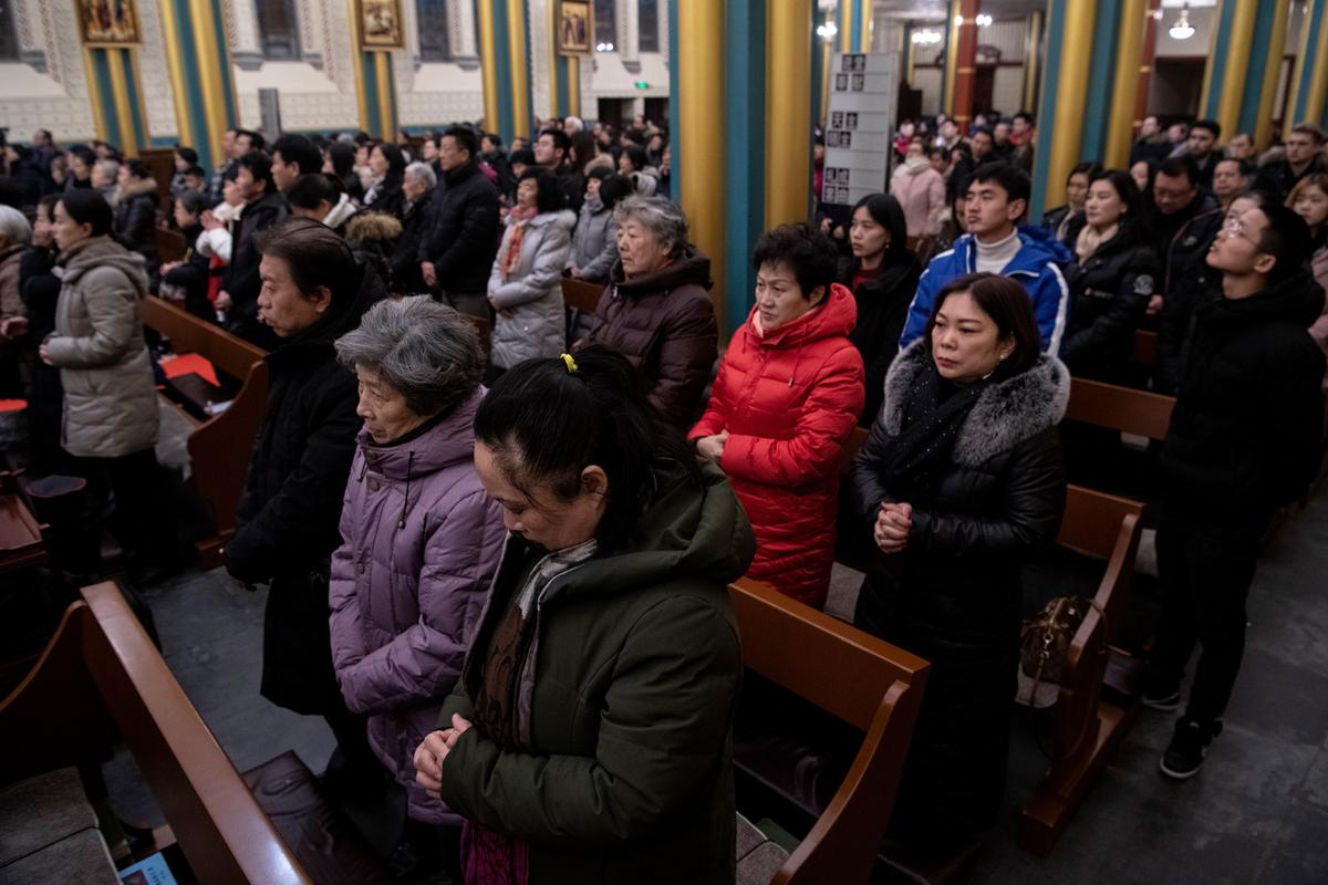 Worshippers attend a Christmas Eve mass at the Xishiku Cathedral in Beijing on Dec. 24, 2019. (NOEL CELIS/AFP via Getty Images)