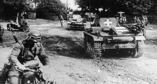 Without a formal declaration of war, German tanks, escorted by troops on motorcycles, drive into Poland on Sept. 1, 1939. (Pictorial Parade/Getty Images)