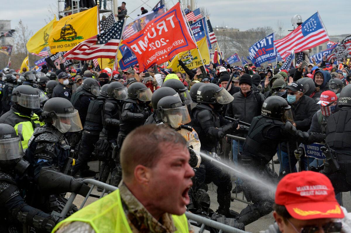 Protesters clash with police, who deploy crowd control measures, outside the U.S. Capitol in Washington, on Jan. 6, 2021. (Joseph Prezioso/AFP via Getty Images)