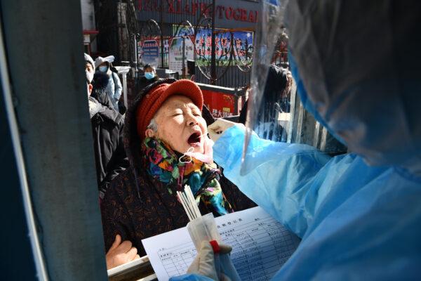 Medical workers are taking swab samples from residents in Shijiazhuang, in northern China's Hebei Province on Jan. 6, 2021. (STR/CNS/AFP via Getty Images)