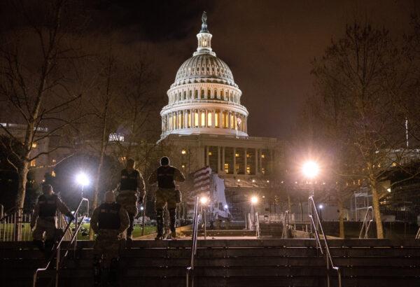 National Guard troops walk through the grounds of the U.S. Capitol in Washington, on Jan. 6, 2021. (John Moore/Getty Images)