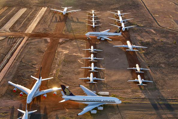 Grounded aeroplanes which include Airbus A380s, Boeing MAX 8s and other smaller aircraft are seen at the Asia Pacific Aircraft Storage facility in Alice Springs, Australia on May 15, 2020. (Steve Strike/Getty Images)