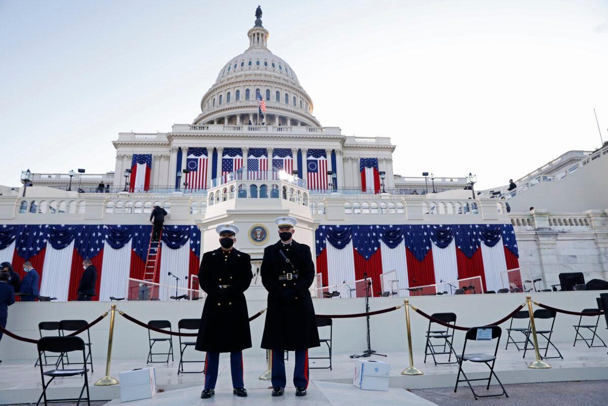Guards stand at the west front of the Capitol before the inauguration of President-elect Joe Biden, in Washington on Jan. 20, 2021. (Brendan Mcdermid/Reuters)