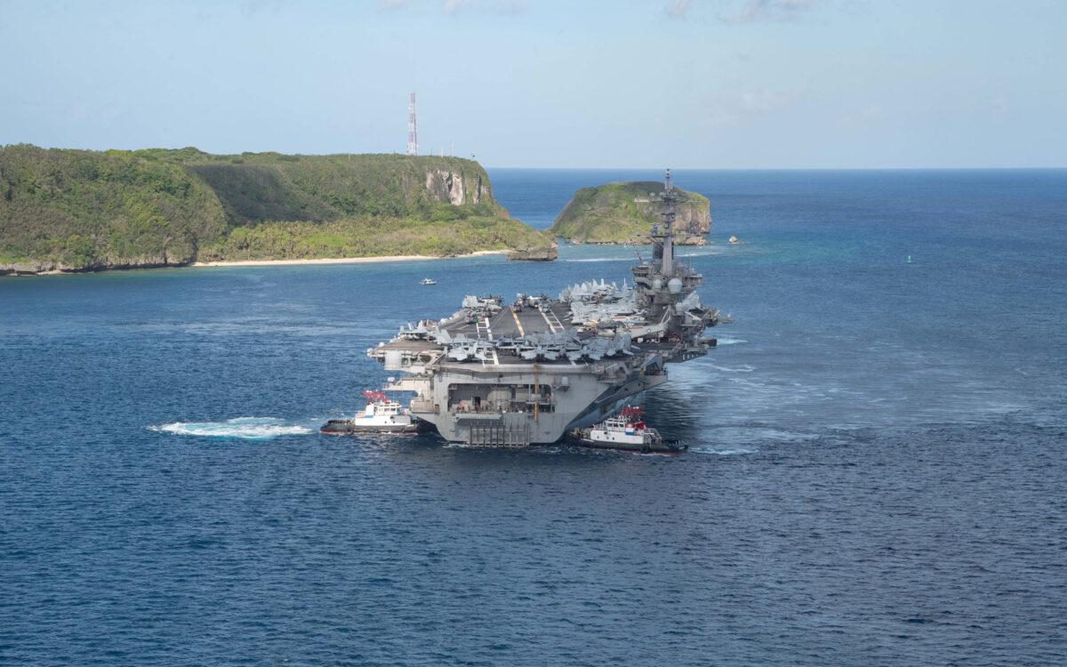The U.S. Navy aircraft carrier USS Theodore Roosevelt departs from Apra Harbor, Guam, on May 21, 2020. (U.S. Navy/Mass Communication Specialist Seaman Kaylianna Genier/Handout via Reuters)