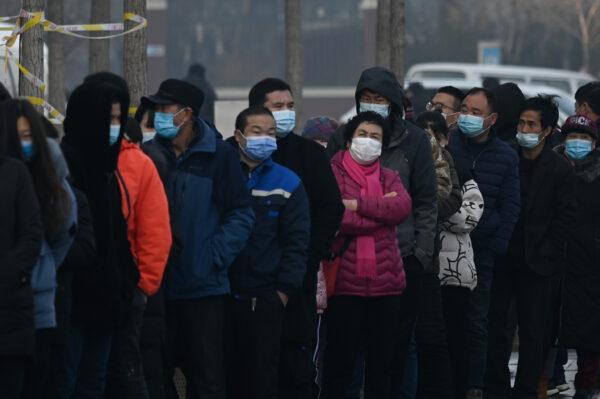 People line up to be tested for COVID-19 at Daxing district in Beijing, China, on Jan. 26, 2021. (Stringer/AFP via Getty Images)